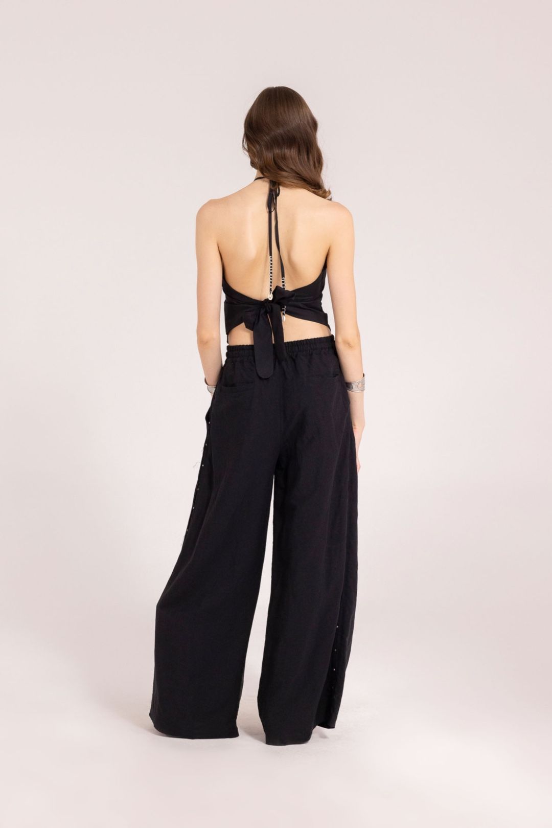 PANTALONE CON BORCHIE